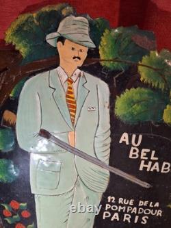 Ancienne Plaque publicitaire en tole peinte Au bel habit