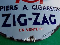 Ancienne plaque emaillée pas courante ZIG-ZAG, bombée
